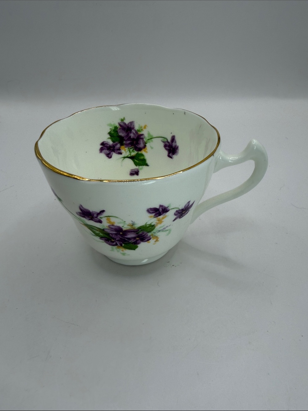 Aynsley bone chine solo Teacup with Violette patter and Gold Trim